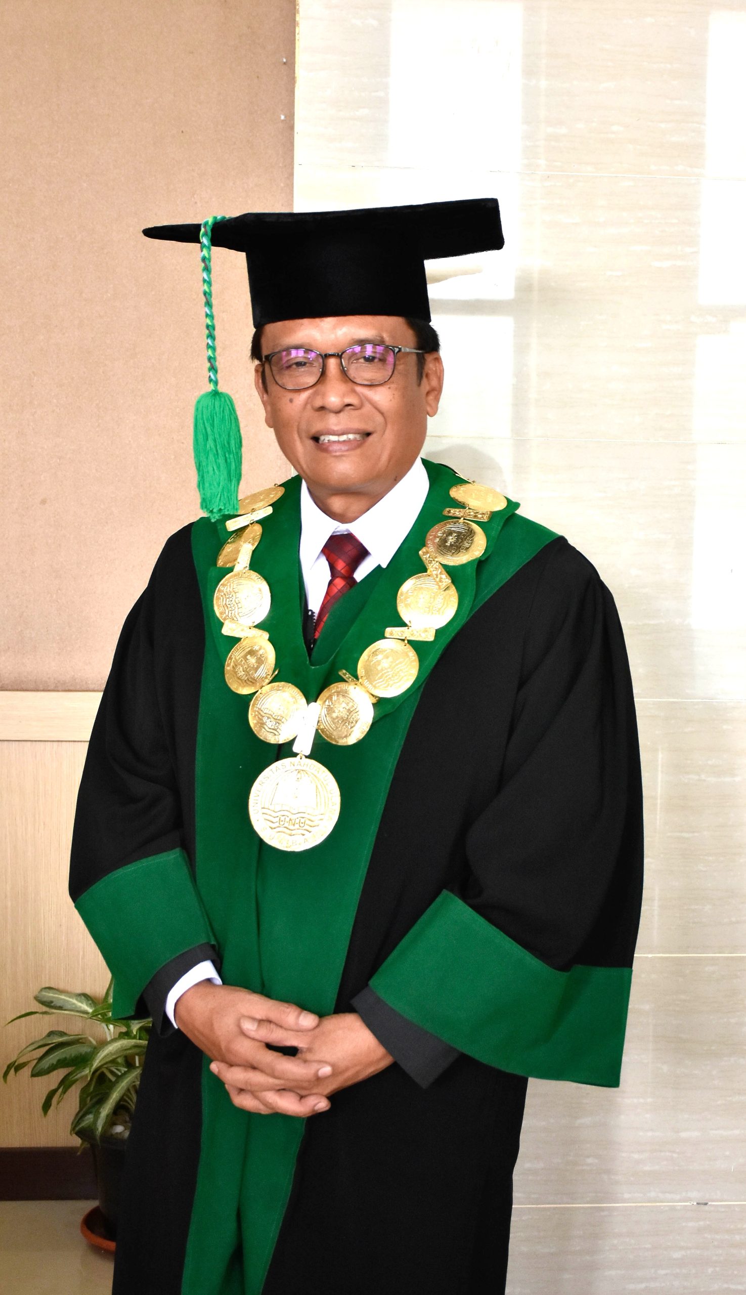Prof. Dr. Yunia Wardi, Drs., M.Si.